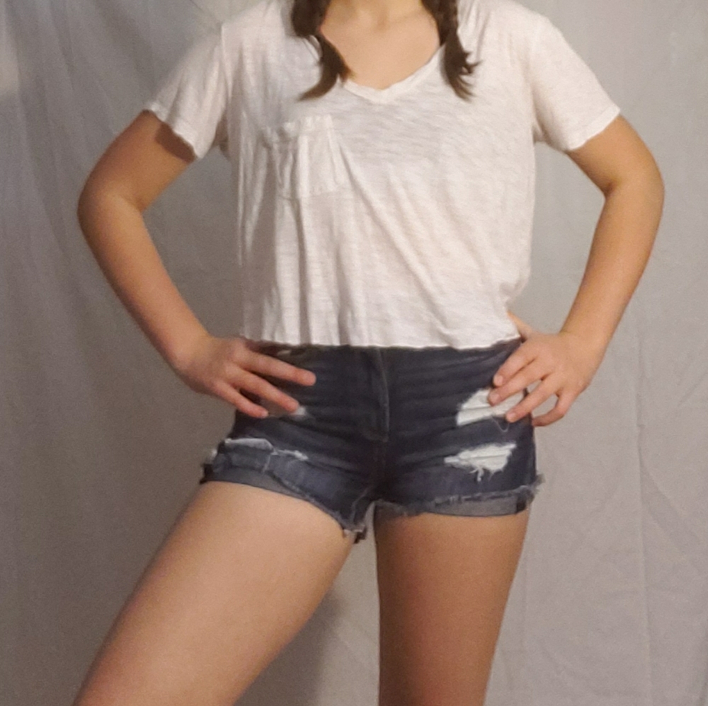 A white hand cropped top